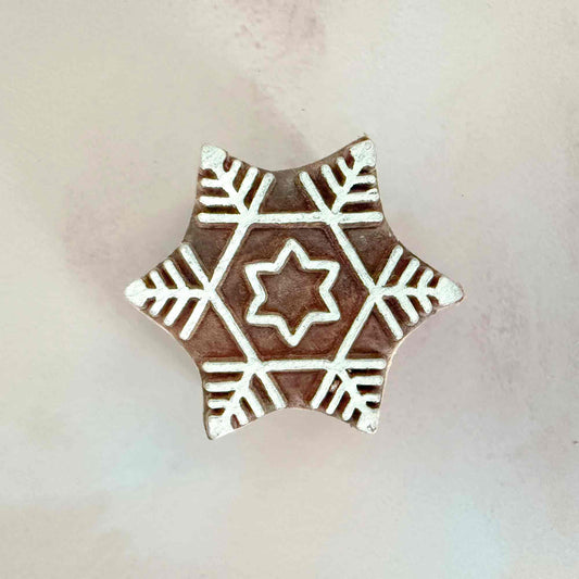 Decorative wooden stamp with snowflake pattern 