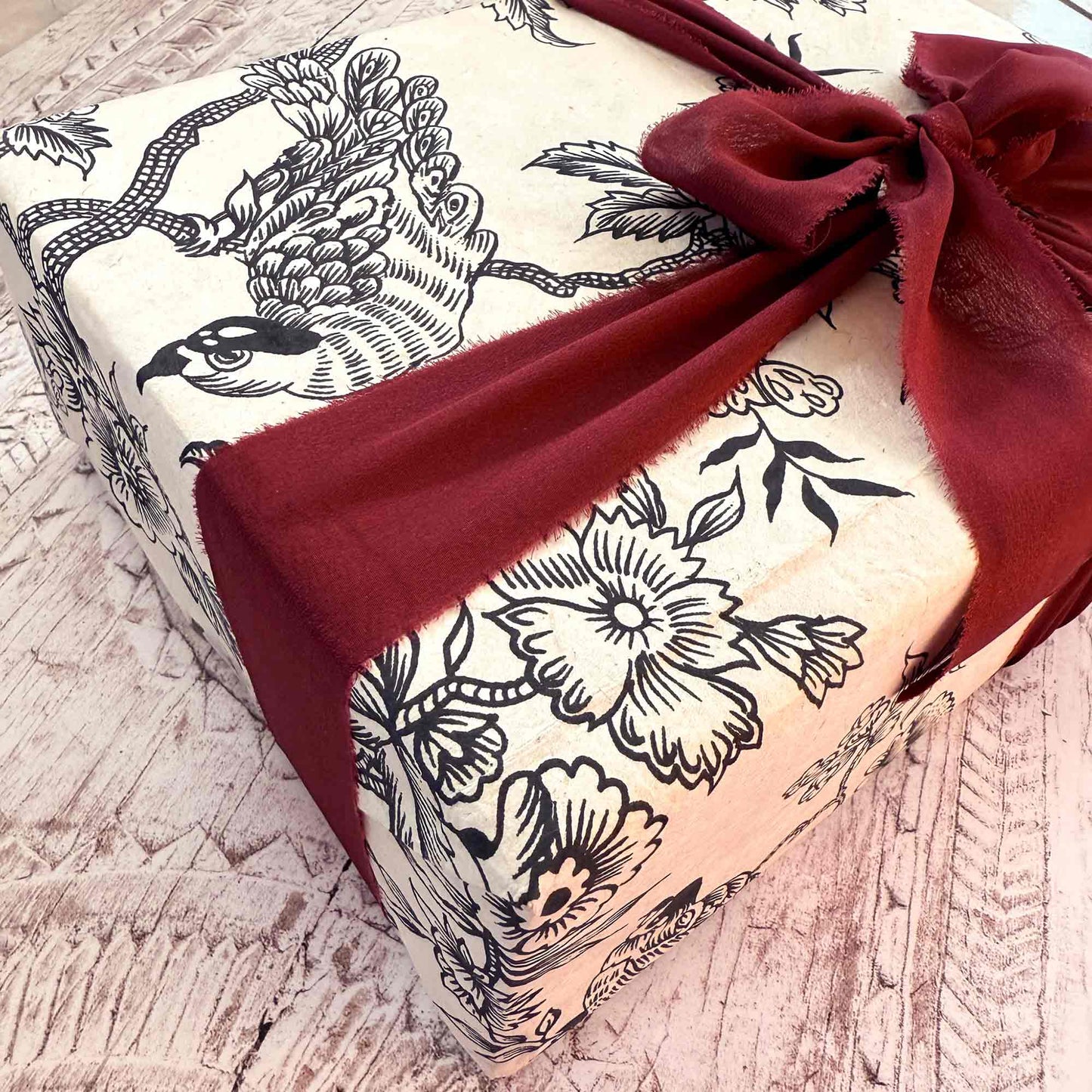 gift wrapped in eco friendly wrapping paper with silk ribbon