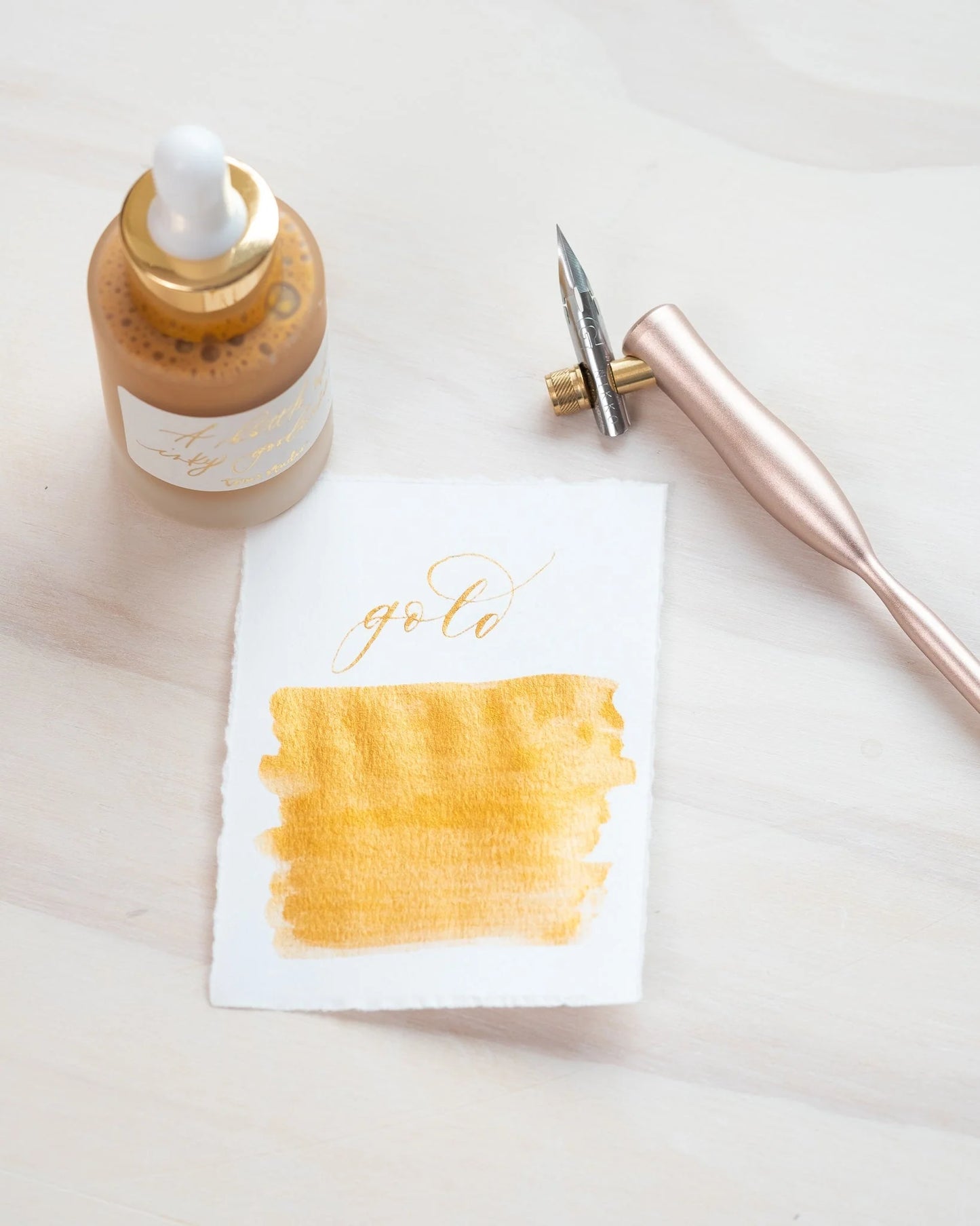 Metallic gold ink for use with calligraphy pens.  Water resistant gold ink by Tom's Studio