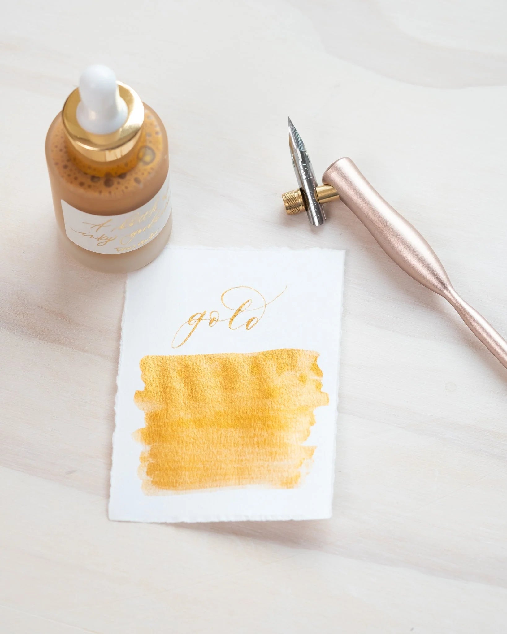 Metallic gold ink for use with calligraphy pens.  Water resistant gold ink by Tom's Studio