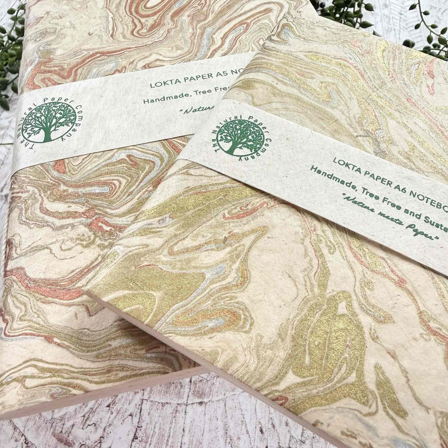 Midas Marble Lokta paper notebooks A5 and A6, handmade in Nepal. Hand‑marbled gold and copper swirls, hand‑stitched binding from The Natural Paper Company