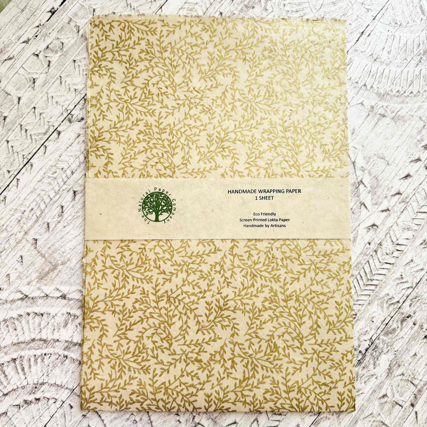 Handmade wrapping paper with gold vine pattern