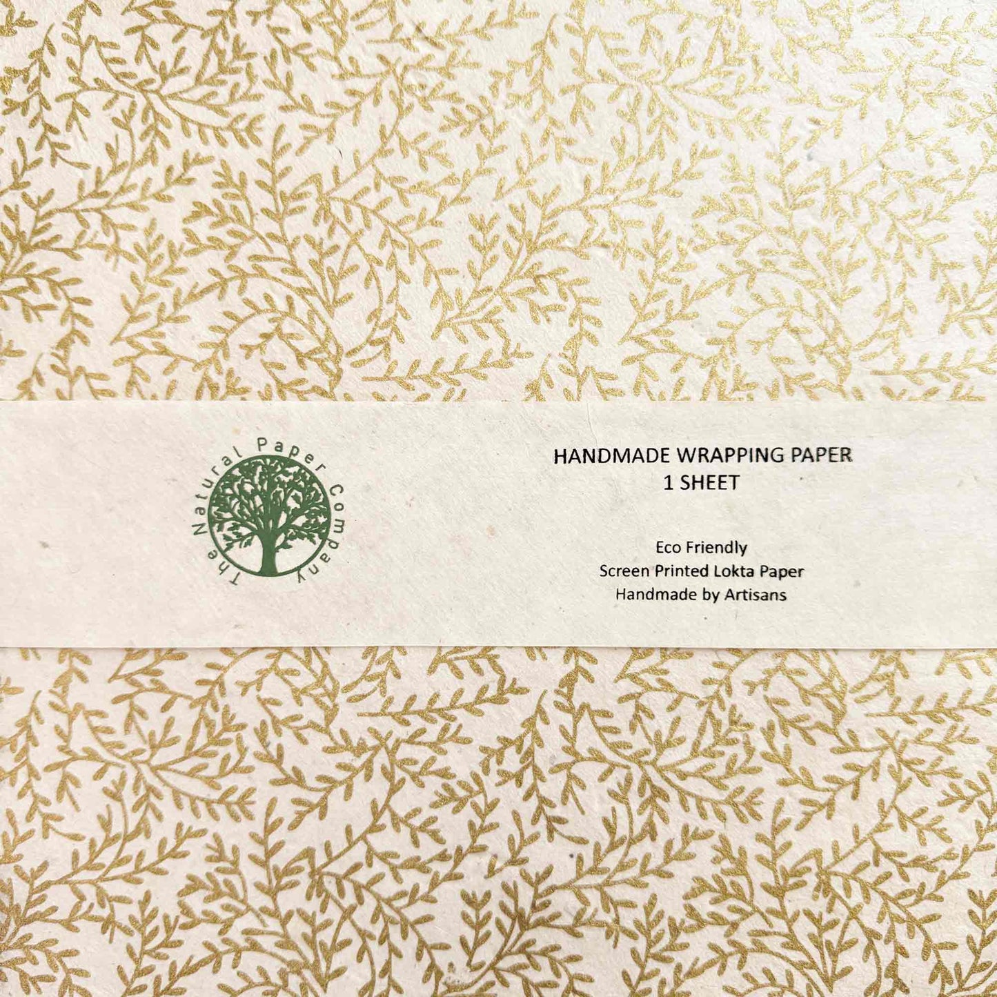 Handmade wrapping paper sheet with leaf pattern and eco-friendly label.