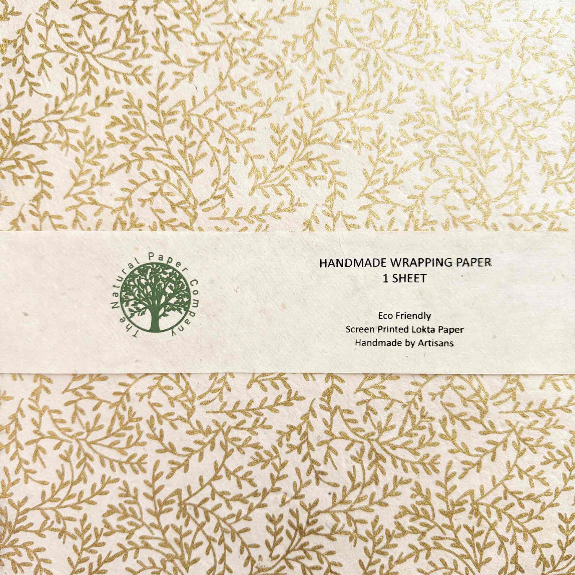 Handmade wrapping paper sheet with leaf pattern and eco-friendly label.