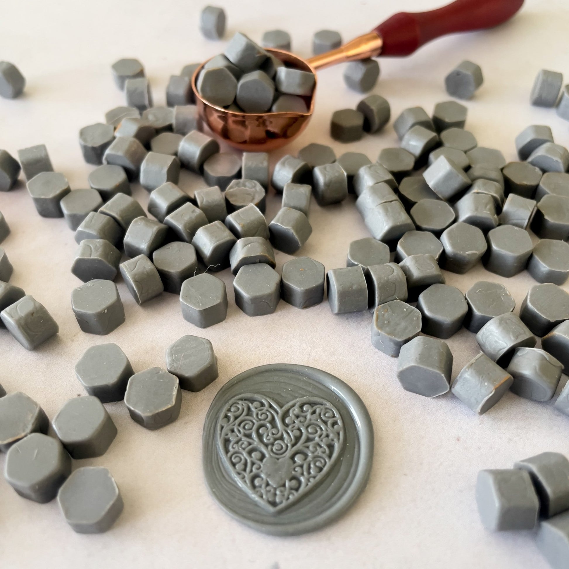 Sealing wax beads in graphite grey.  Small beads of eco friendly wax to make wax seals.  by The Natural Paper Company