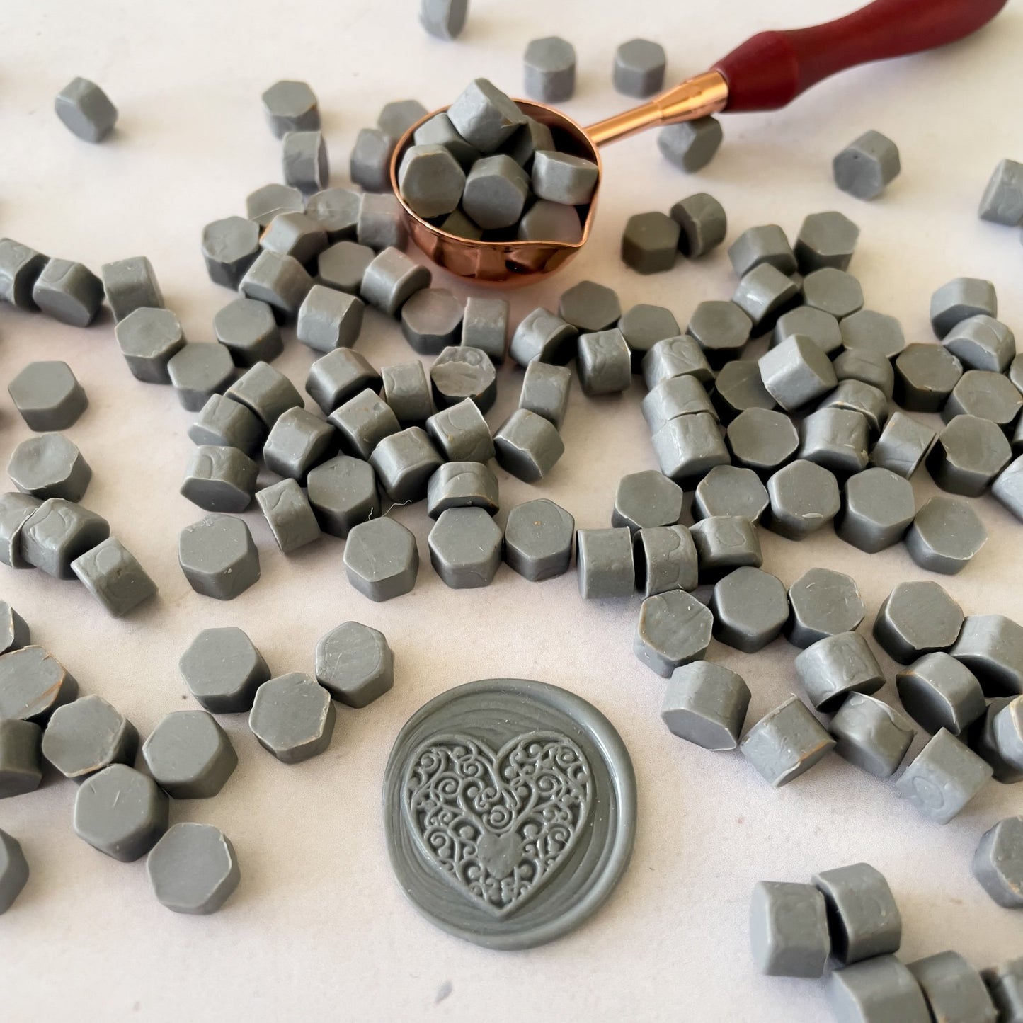 Grey sealing wax beads to make wax seals.  Eco friendly wax beads to use with a melting spoon and wax stamp.  by The Natural Paper Company