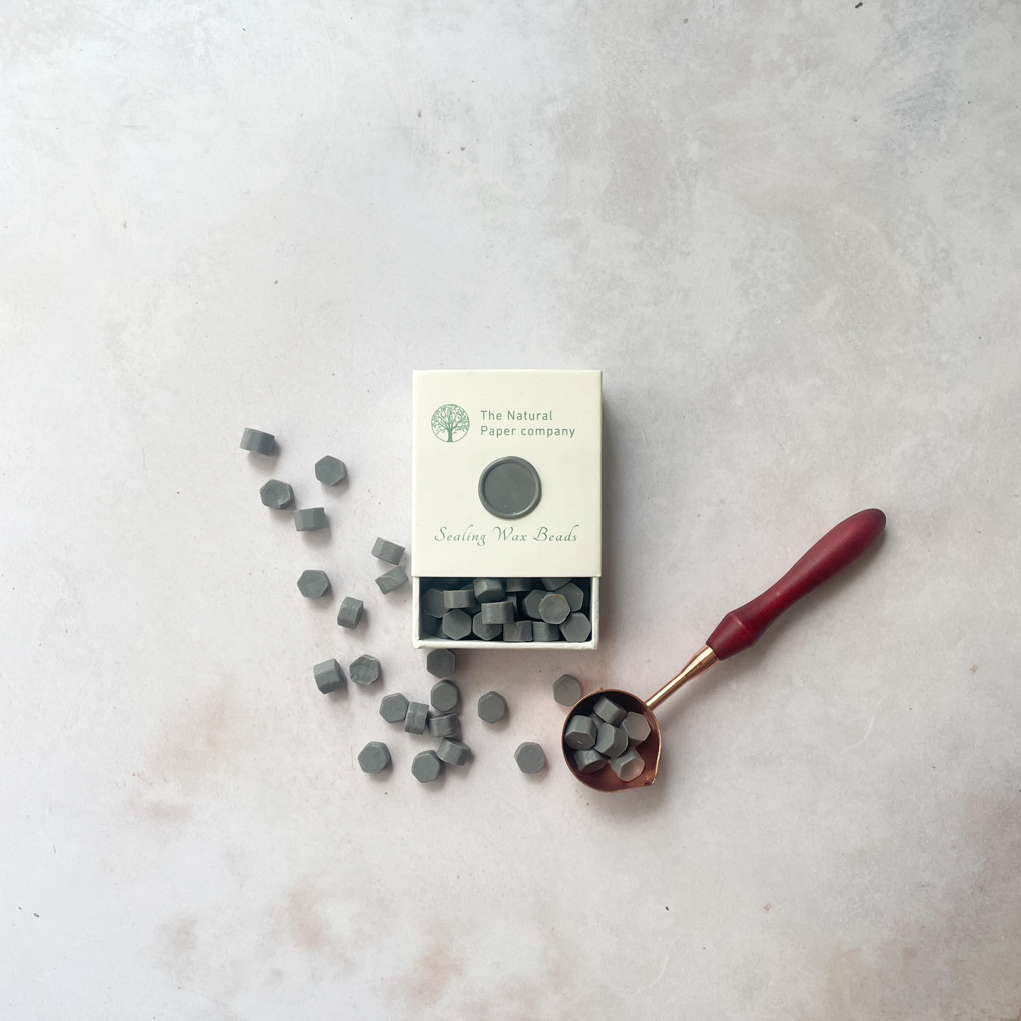 Eco friendly sealing wax beads in grey.  Box of wax to make wax seals.  Plastic free, paraffin free and biodegradable wax to make wax seals for wedding invitations, stationery, gift wrapping or packaging.  By The Natural paper Company