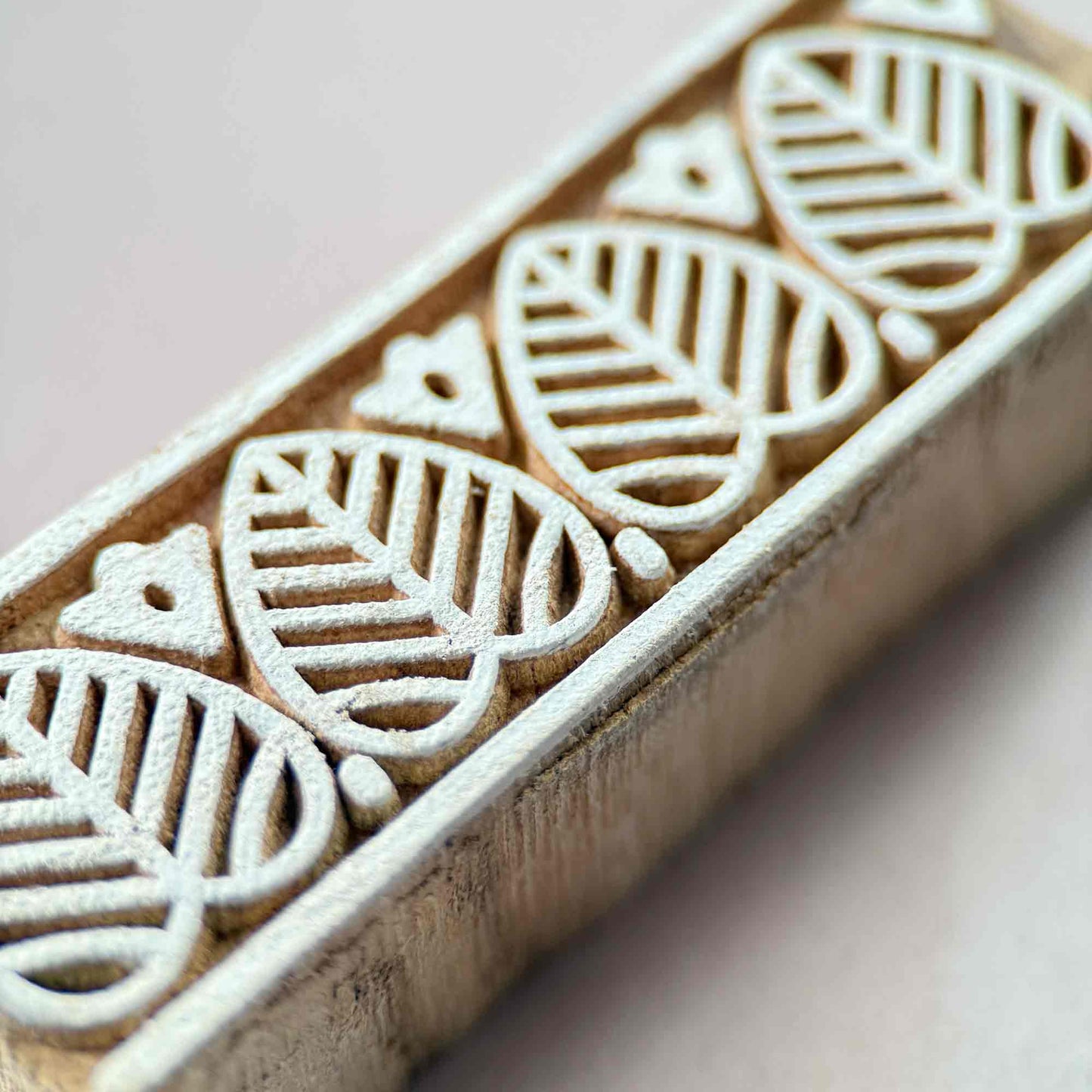 handmade wooden stamp with leaf pattern