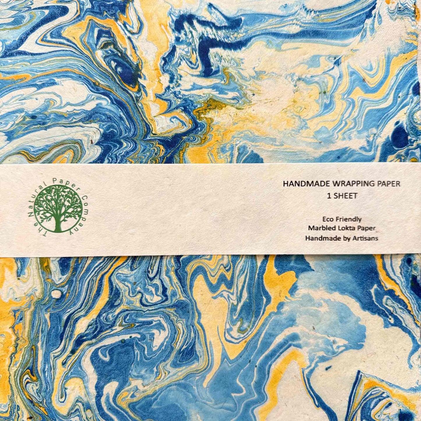 Single sheet of marbled Lokta paper with product label: Handmade Wrapping Paper, eco-friendly, artisan made by The Natural Paper Company