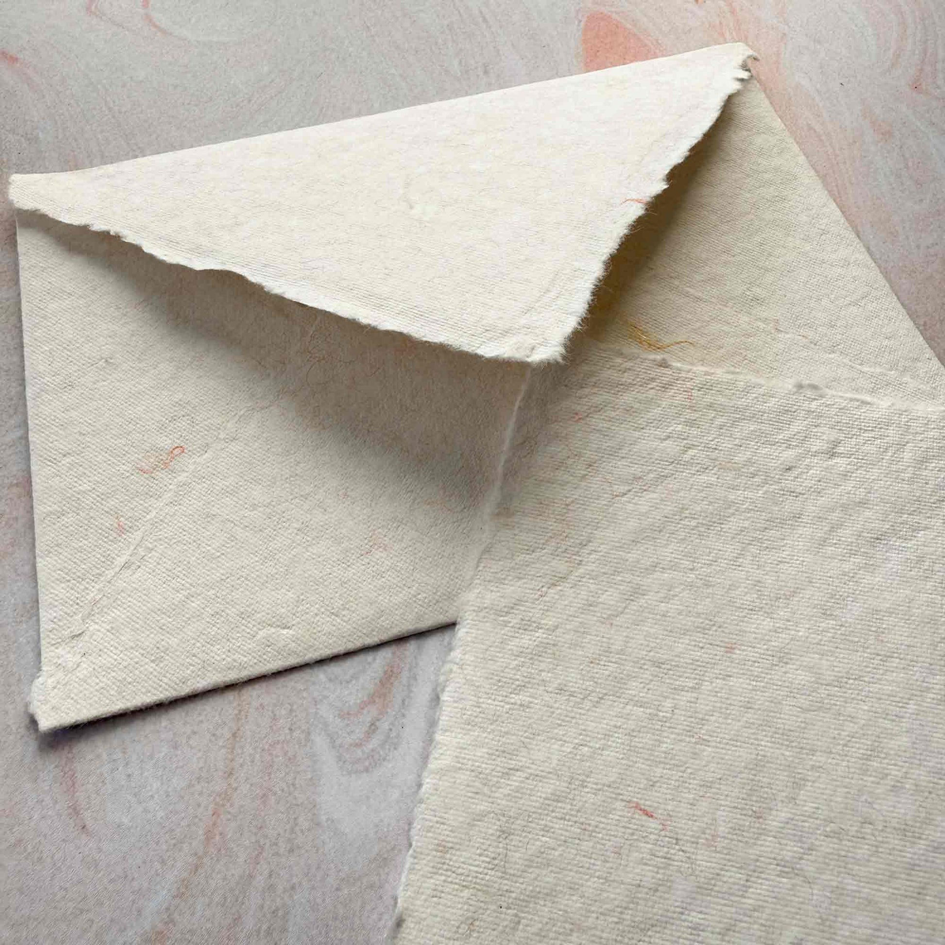 decorative handmade cotton paper and envelopes with deckled edges.  