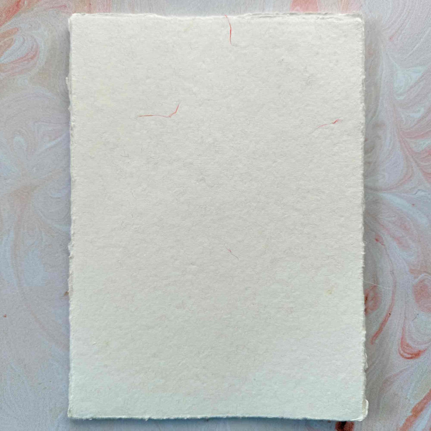 textured handmade paper with decorative details