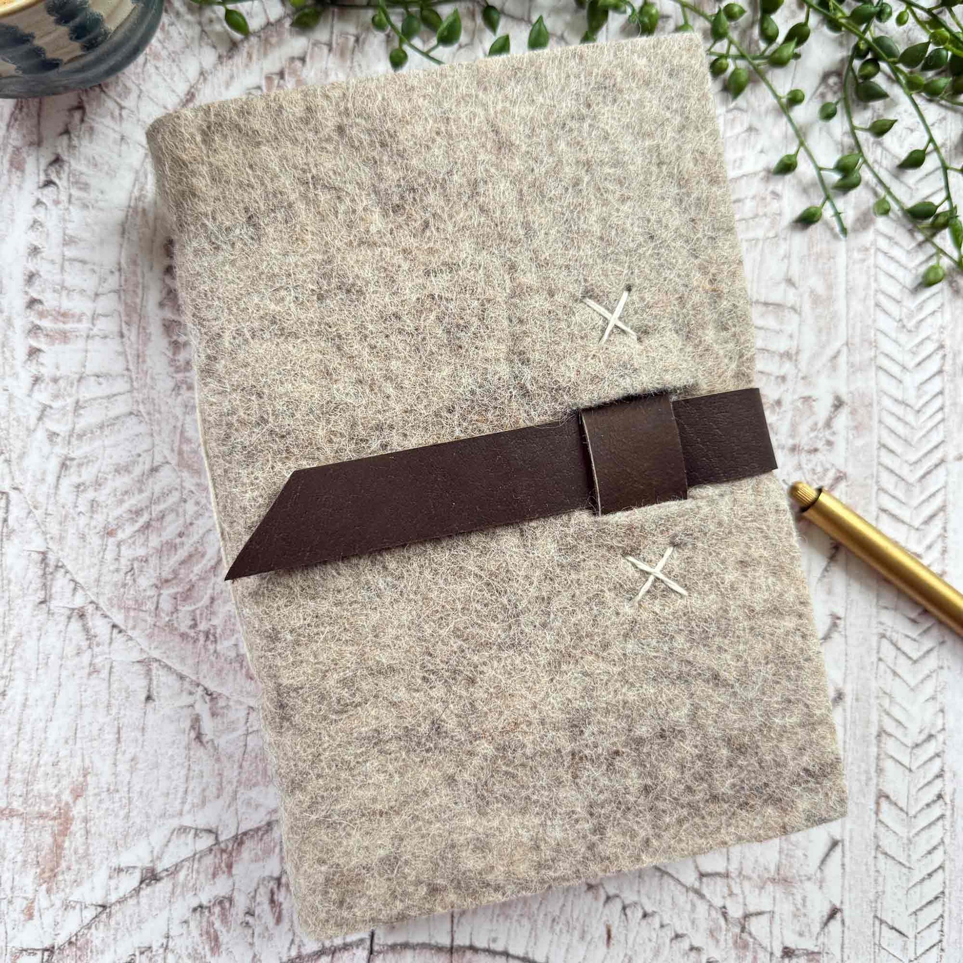 Close-up of felted wool and leather detail on handmade A5 journal from Nepal