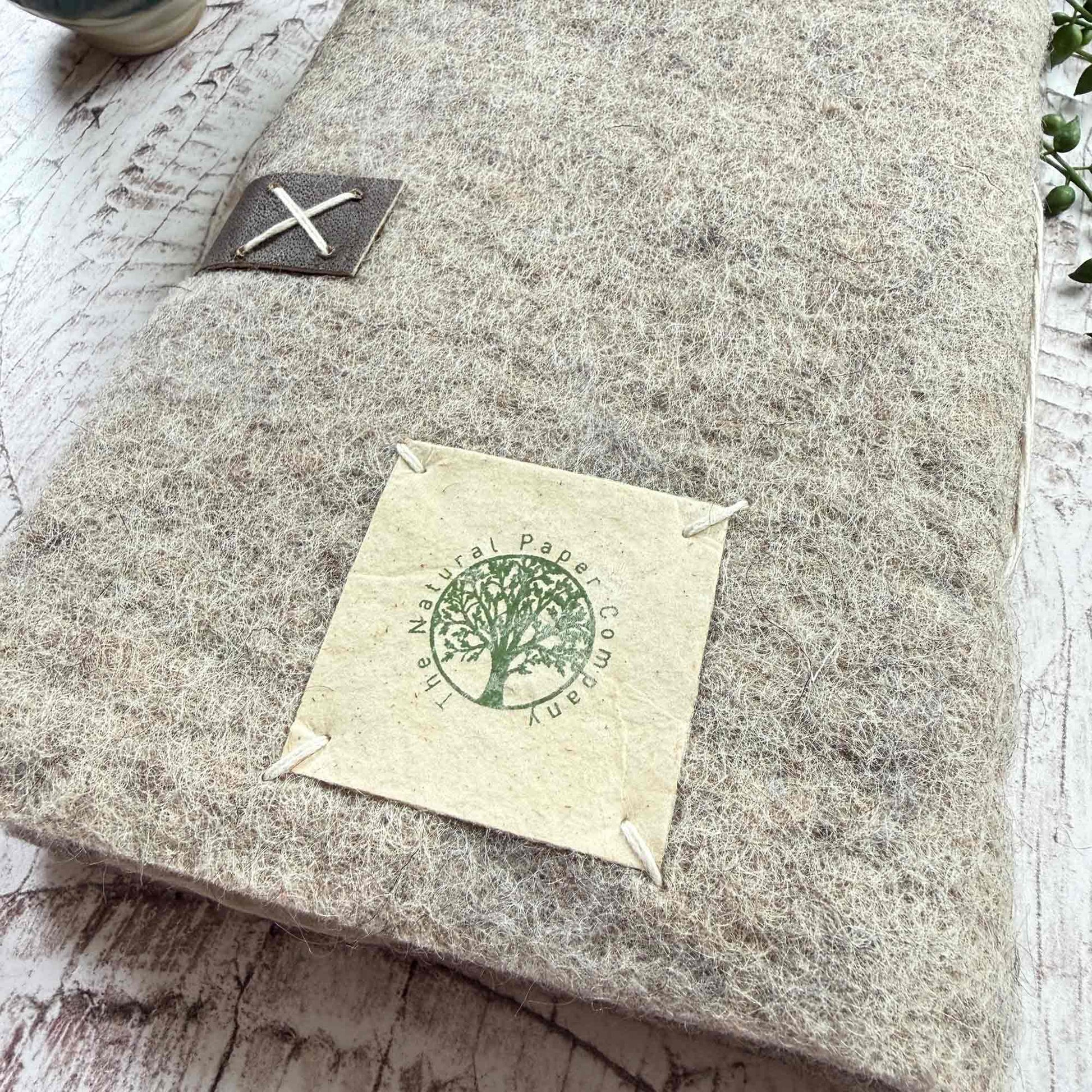 Handmade Lokta paper journal, felt cover with leather detailing and hand stitched, handmade in Nepal by Artisans for The Natural Paper Company