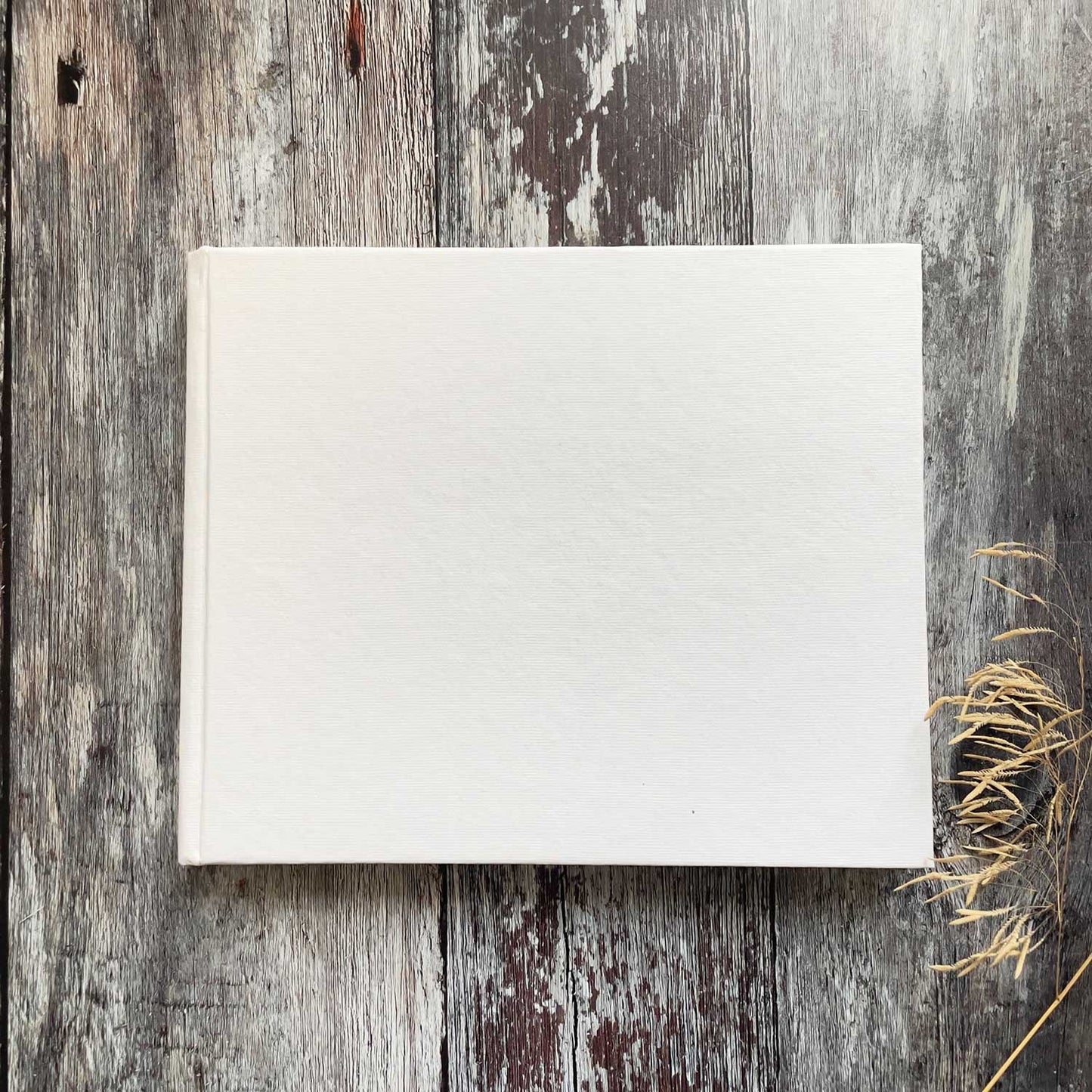 Blank guest book made from recycled paper.  Handmade cotton rag paper with deckled edges.  Hard cover with 50 pages.  Perfect for making wedding guest books, journals and personalised note books.  By The Natural Paper Company