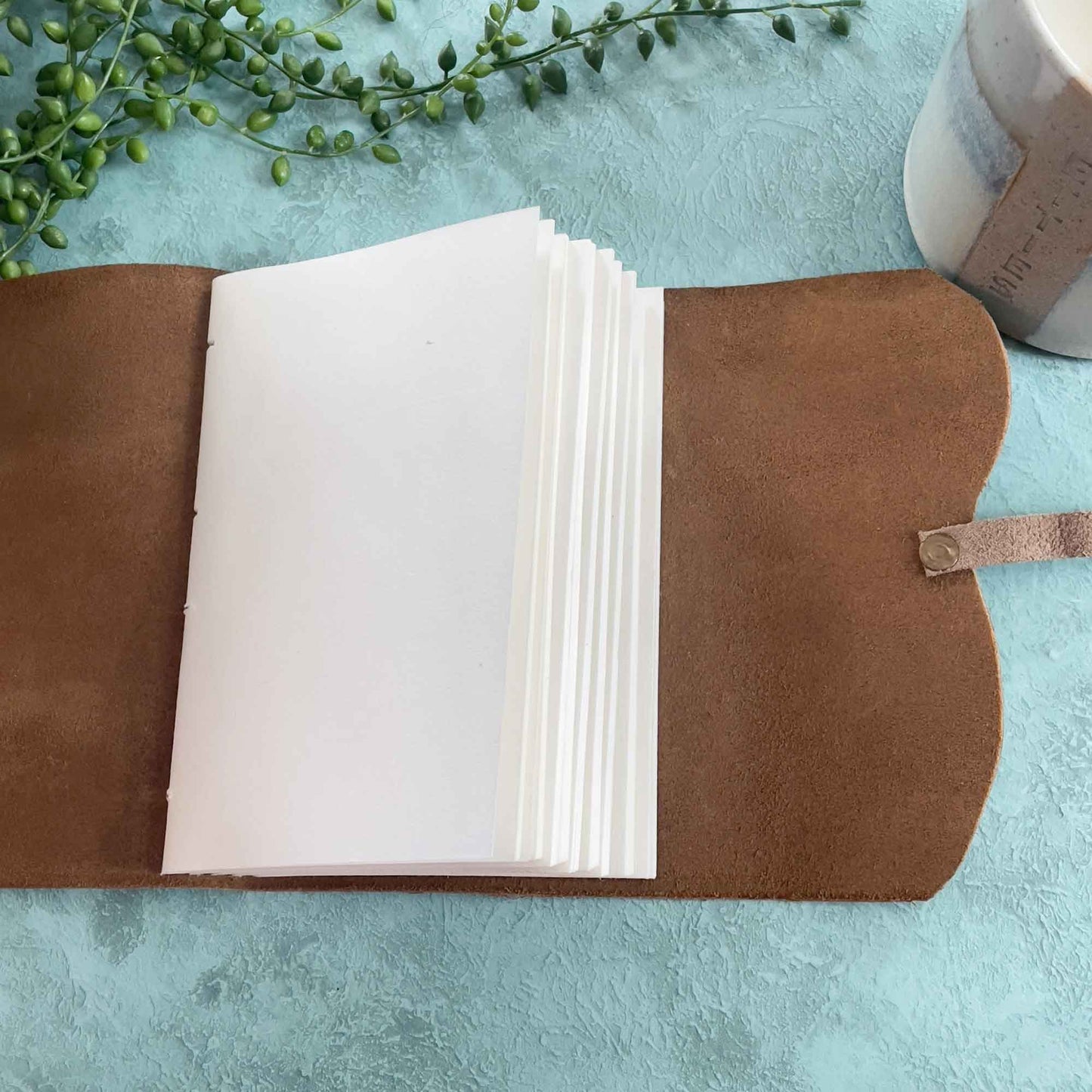 a6 tan leather notebook with handmade cotton rag paper pages