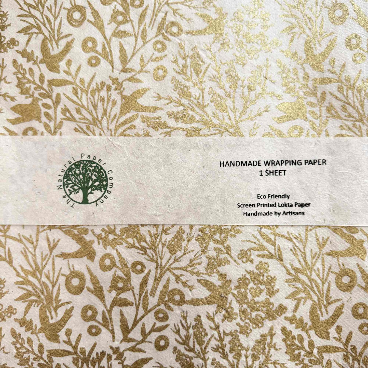 Handmade wrapping paper with gold floral pattern with birds