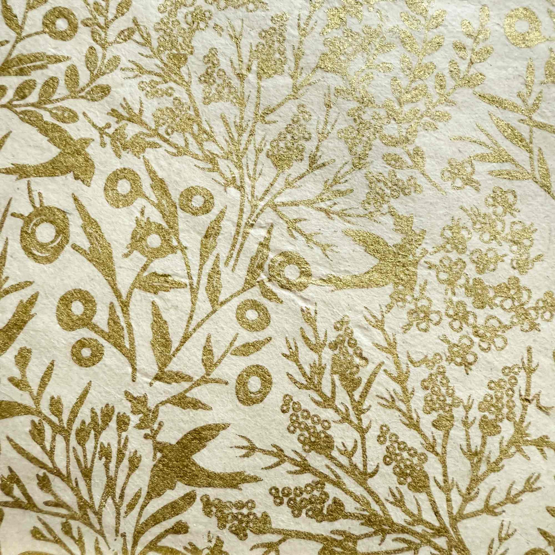 floral pattern wrapping paper with birds in gold and white