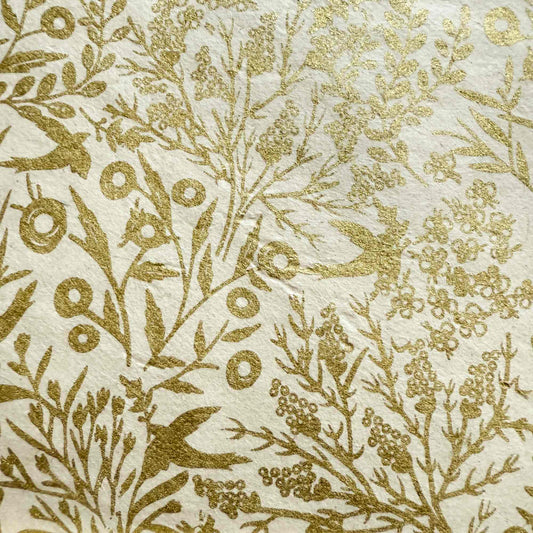 floral pattern wrapping paper with birds in gold and white