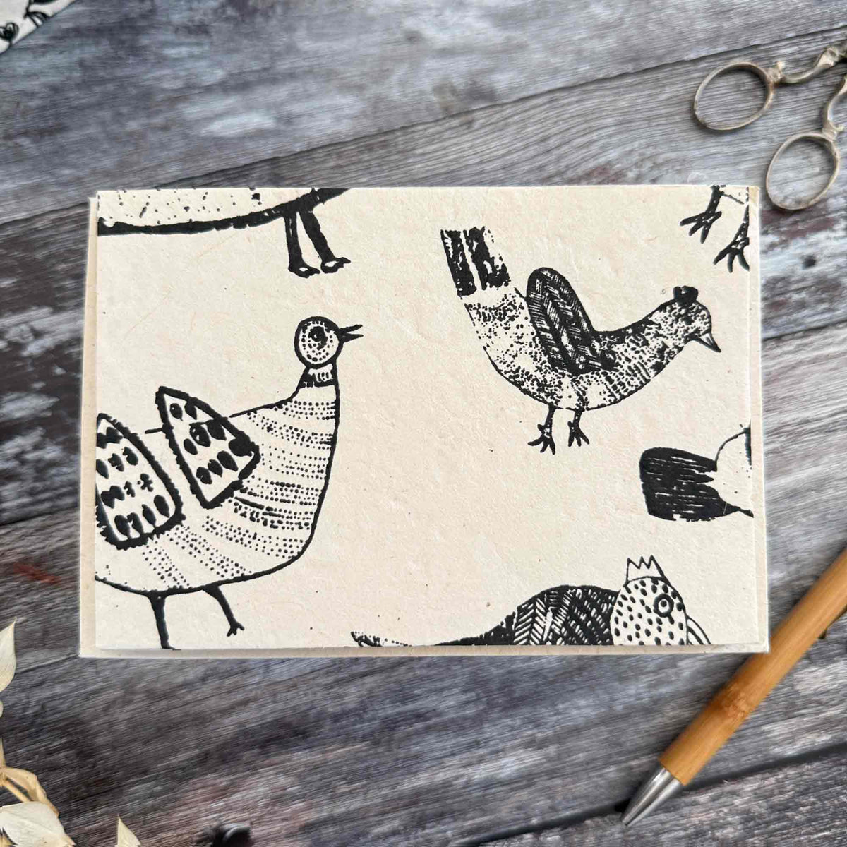 Handmade chicken cards and envelopes with black hen designs on natural Lokta paper