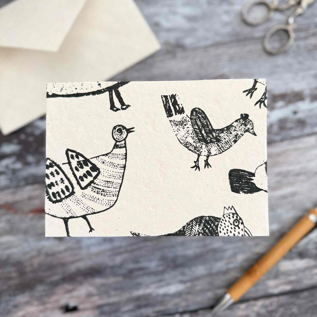 Handmade blank chicken card with black hen illustrations on traditional Lokta paper