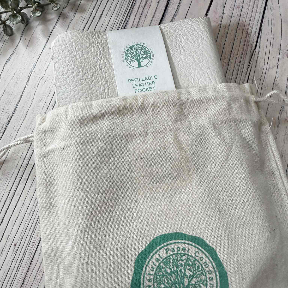 Ivory refillable leather notebook presented in Natural Paper Company drawstring gift bag