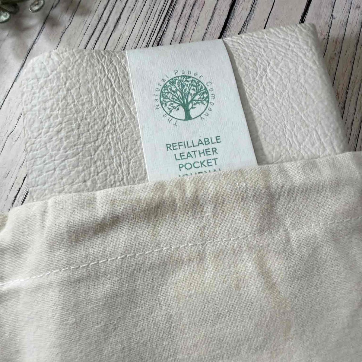 Handmade ivory refillable leather journal presented with cotton drawstring gift bag