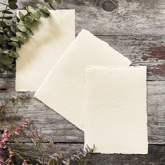 Handmade cotton rag paper in ivory.  Recycled paper with a deckled edge.  Beautiful paper for making wedding invitations and stationery.  By The Natural Paper Company