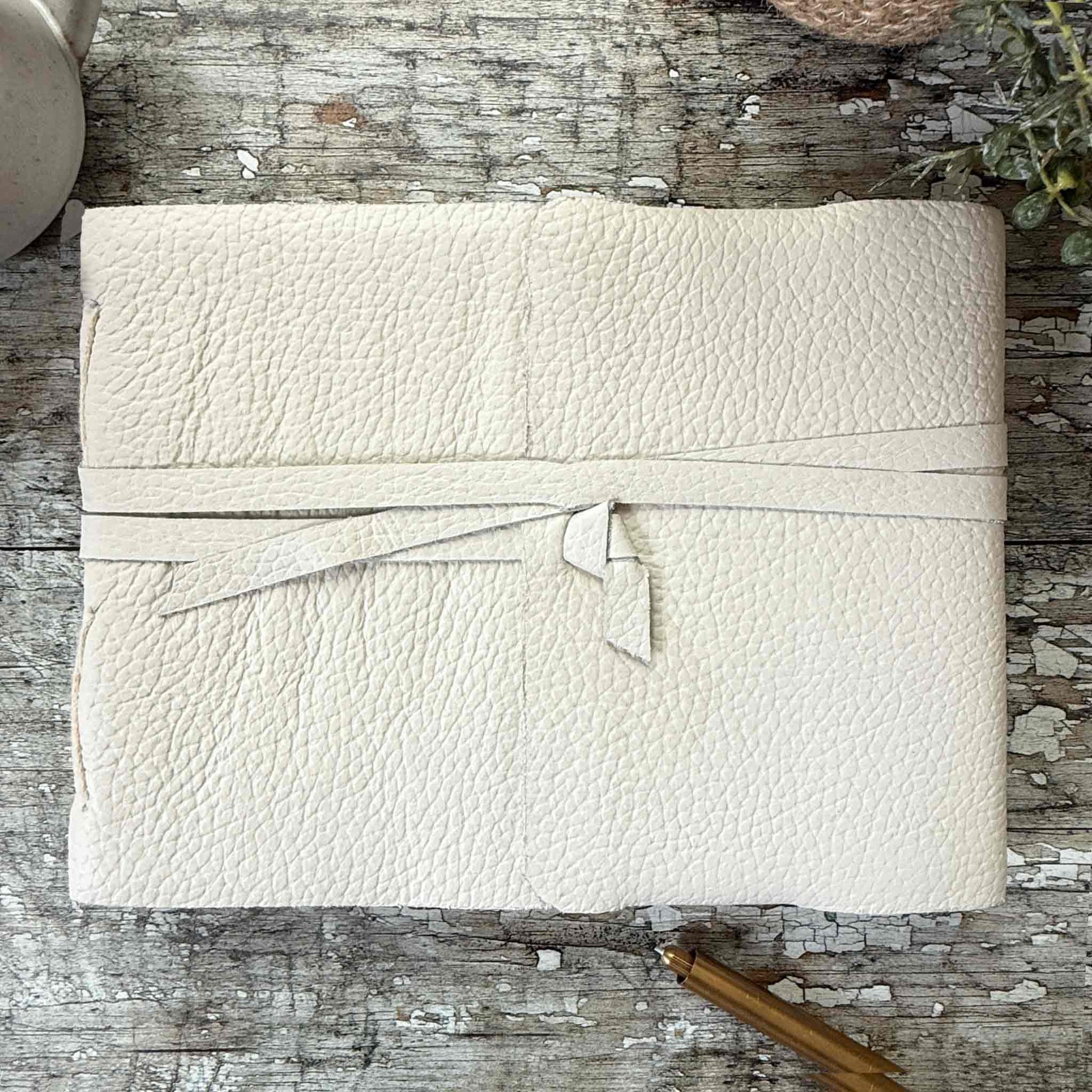 handmade A5 landscape journal with a soft leather cover in ivory