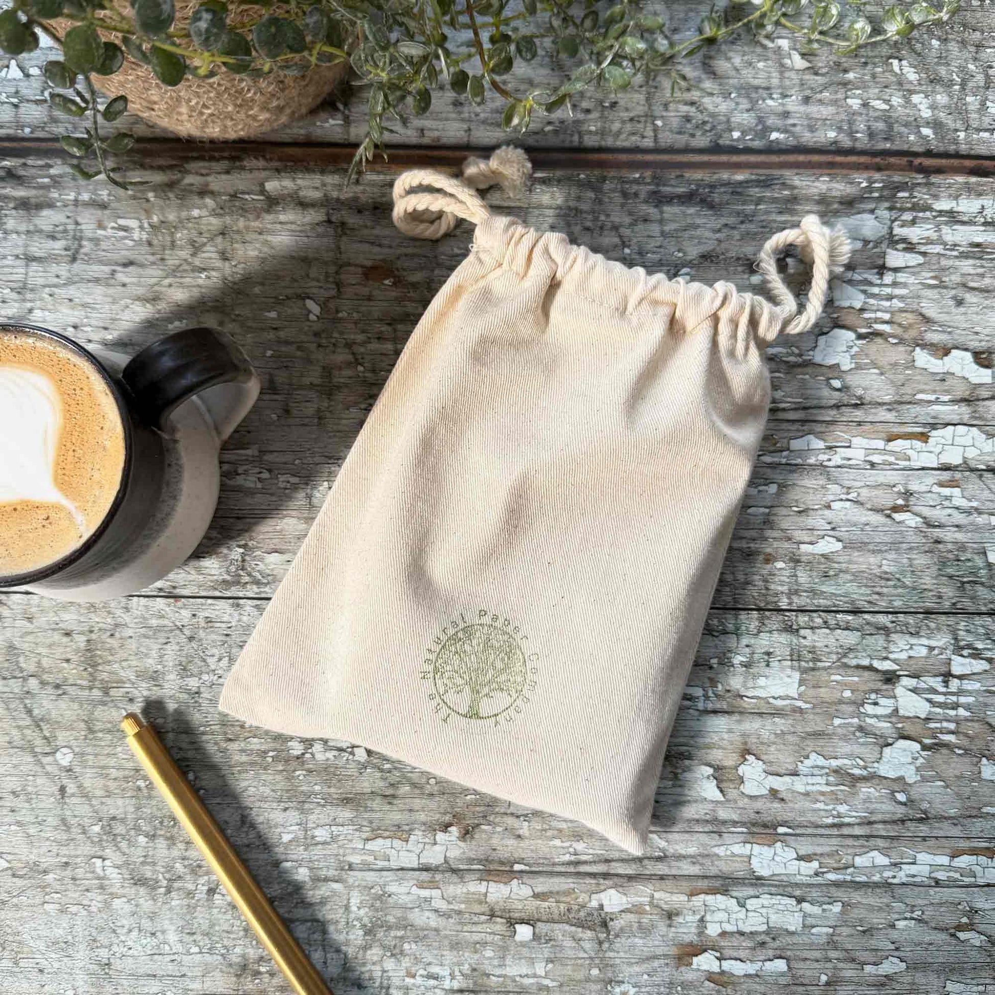 handmade leather journal in a gift bag