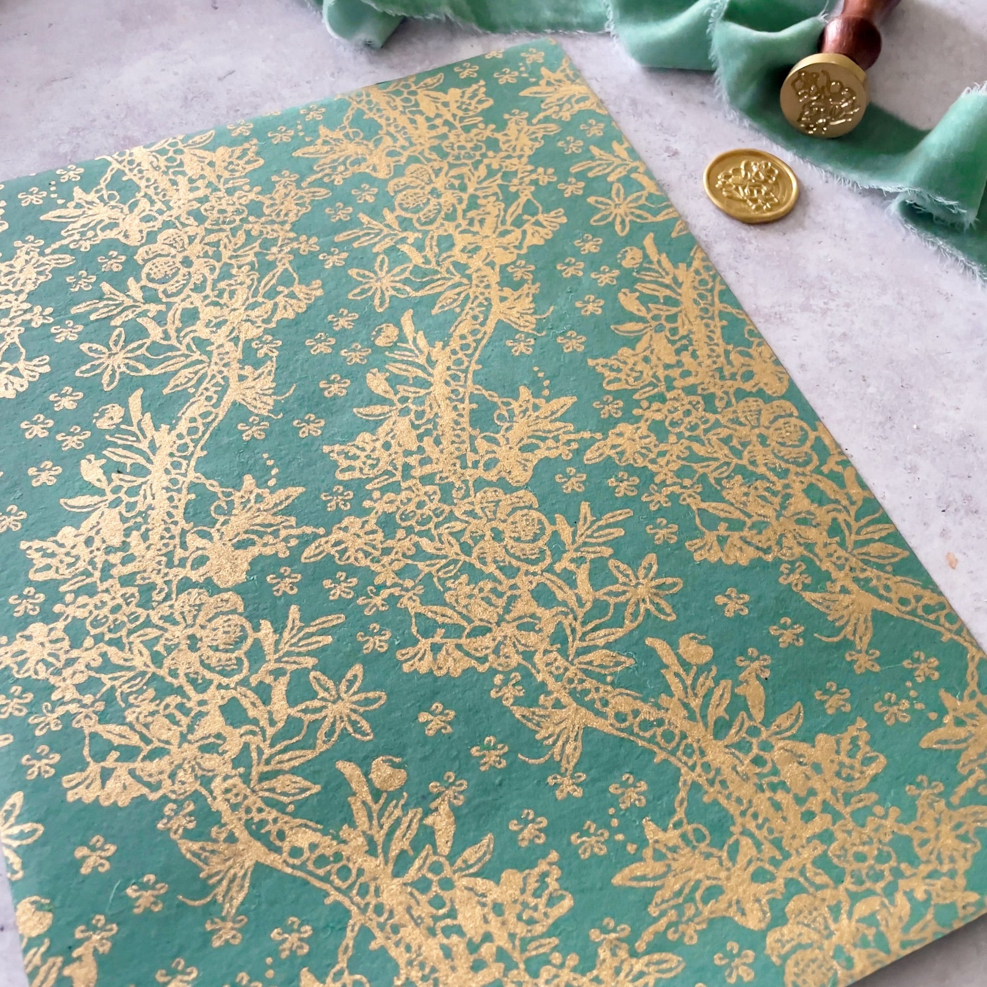 Jade green and gold decorative paper for crafts.  Recycled paper with a pretty gold pattern.  By The Natural Paper Company.