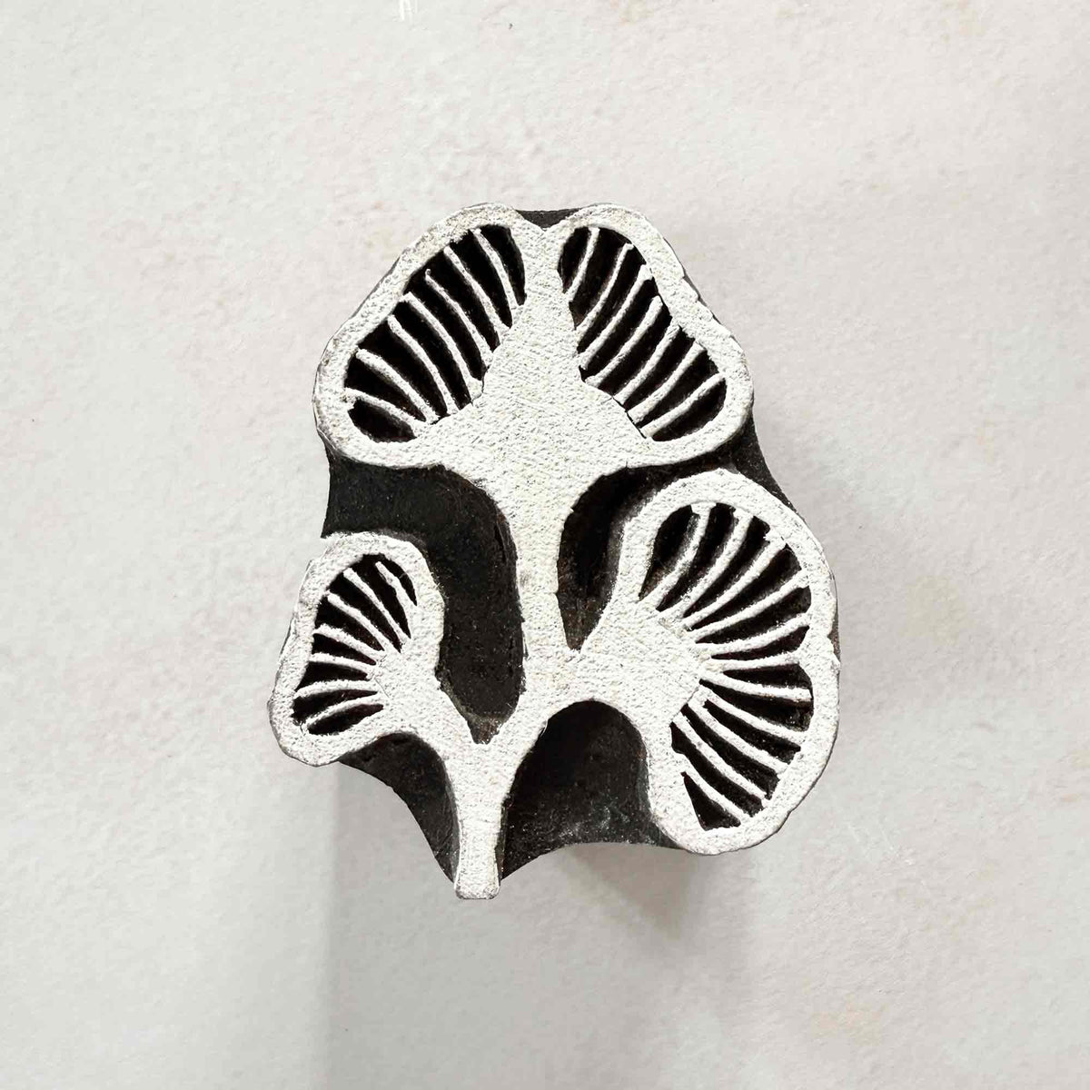 Kelp Indian Wood Block Stamp featuring three seaweed-inspired forms with fine carved radiating lines.