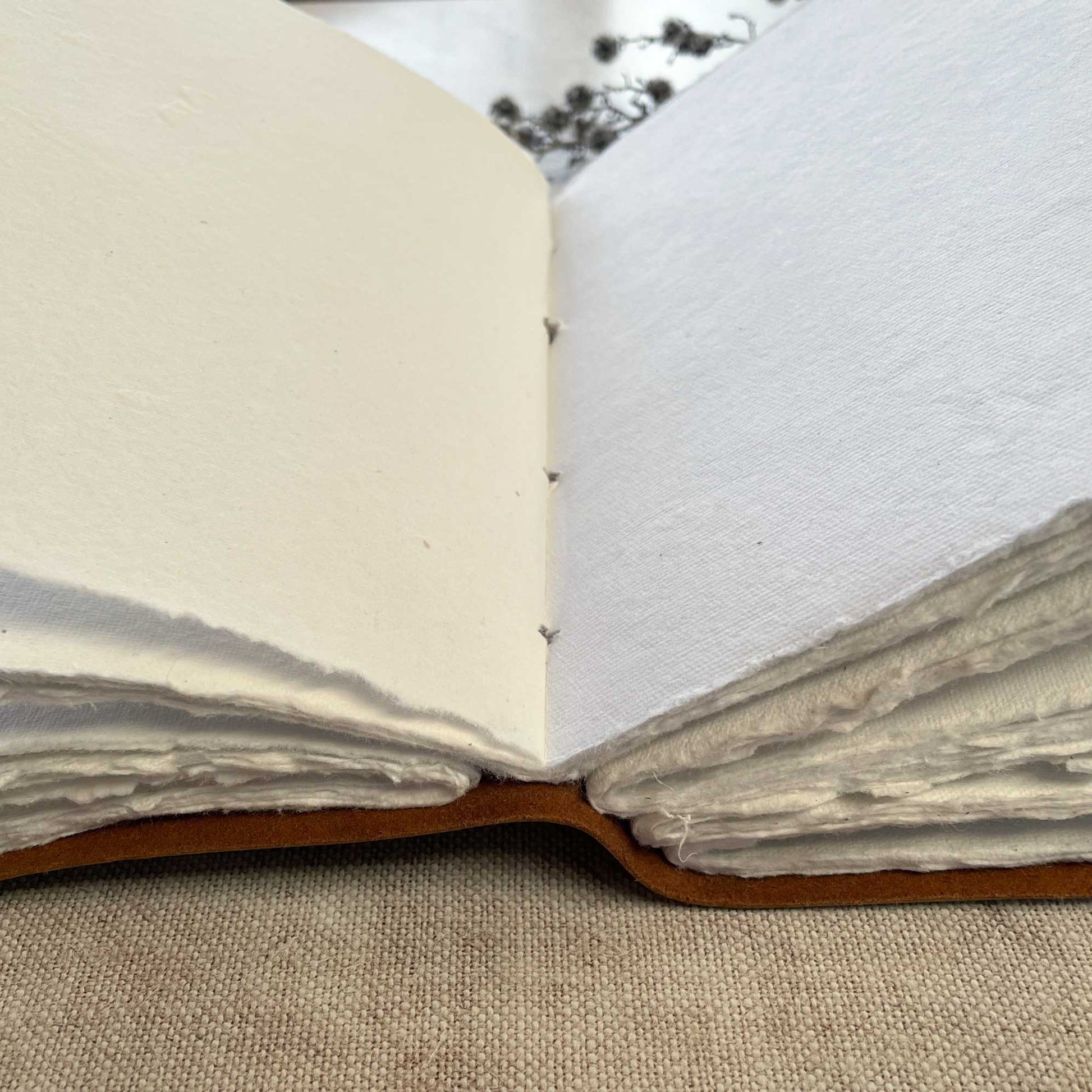 A5 leather bound notebook with deckle edge handmade paper pages.  by The Natural Paper Company