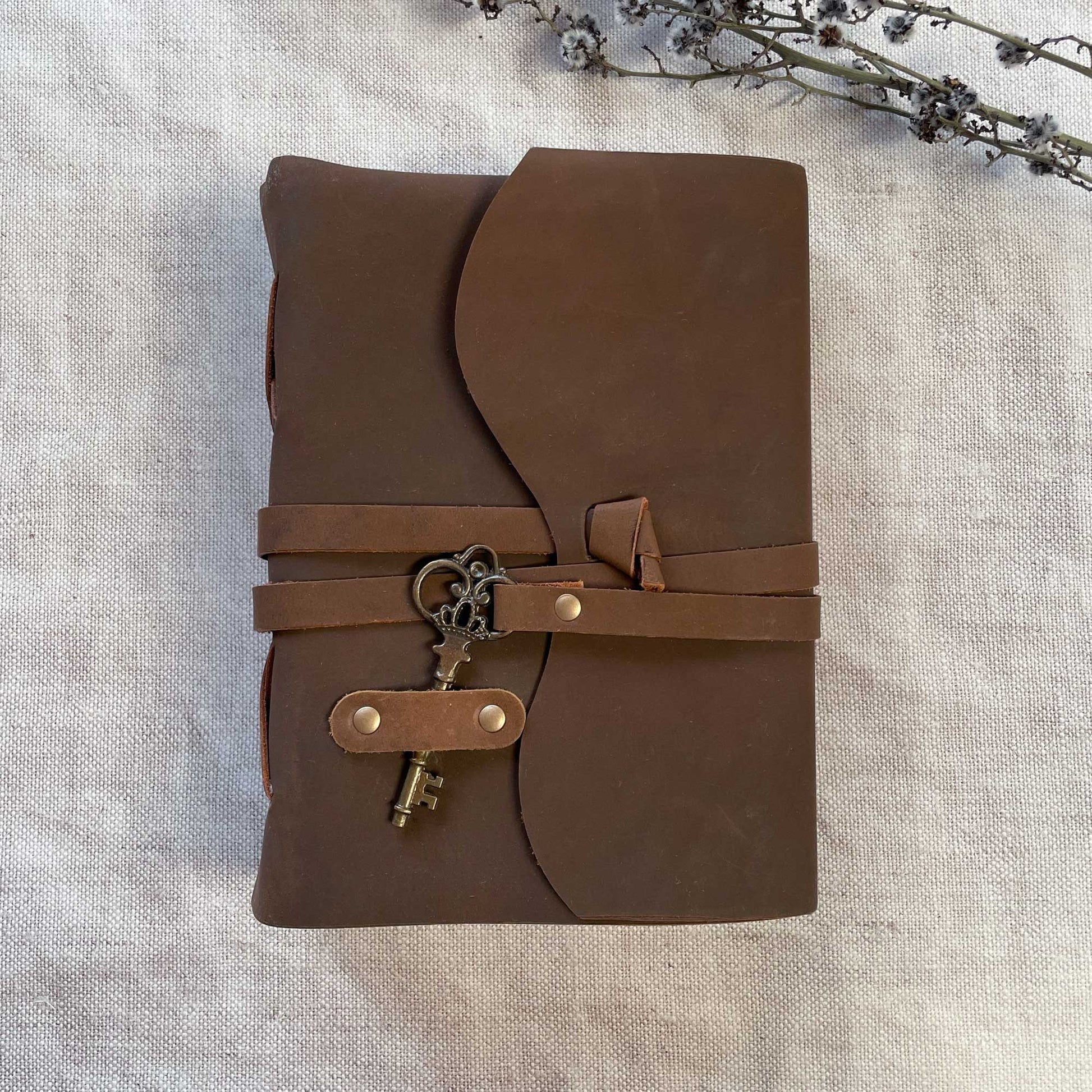 A5 Leather Bound Journal with Key Closure.  Leather notebook with handmade paper sheets.  by The Natural Paper Company