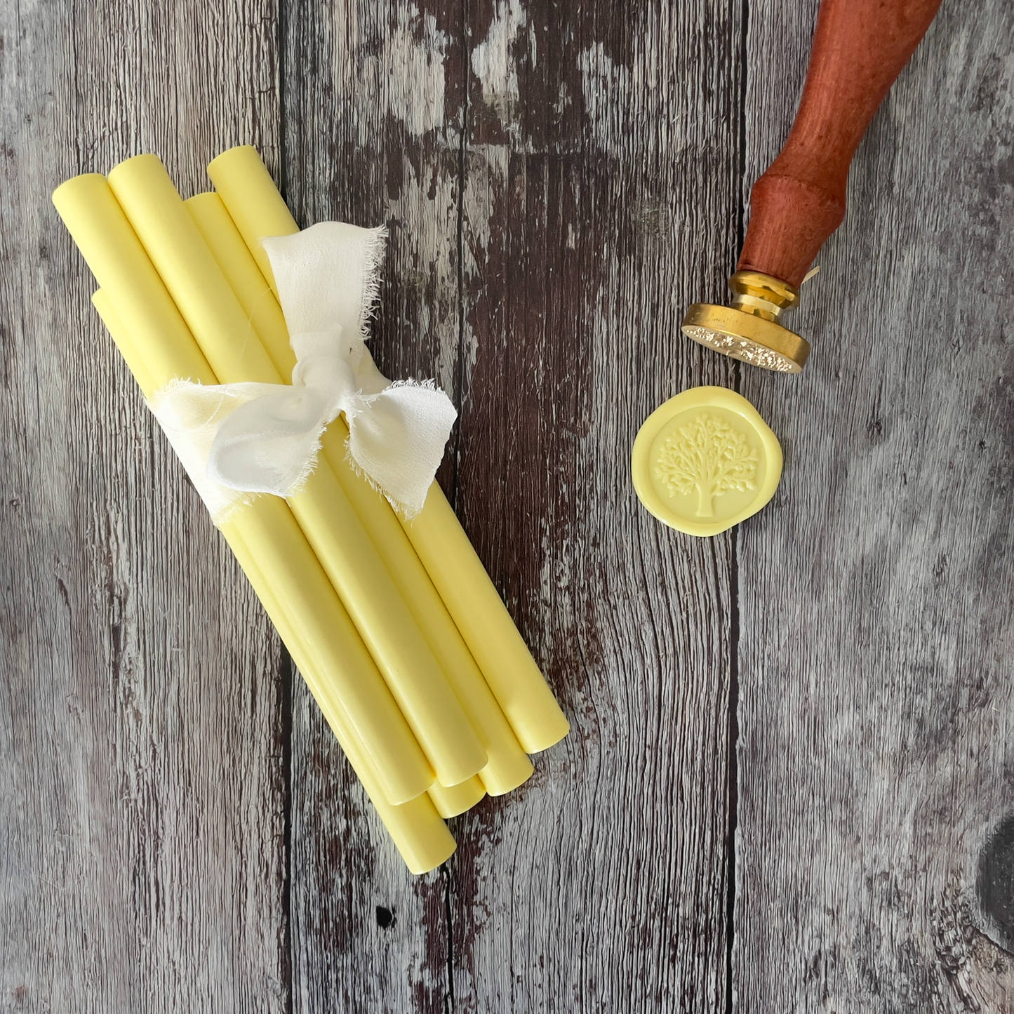 Lemon yellow sealing wax sticks.  Yellow glue gun sealing wax.  Perfect for making eco friendly wax seals.  Plastic free, paraffin free and biodegradable wax By The Natural Paper Company