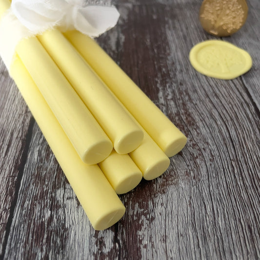 11mm Sealing Wax sticks in lemon yellow.  Make yellow wax seals with our eco friendly glue gun sealing wax sticks.  Can be used with a glue gun or melting spoon.  Plastic free, paraffin free and biodegradable wax.  By The Natural Paper Company