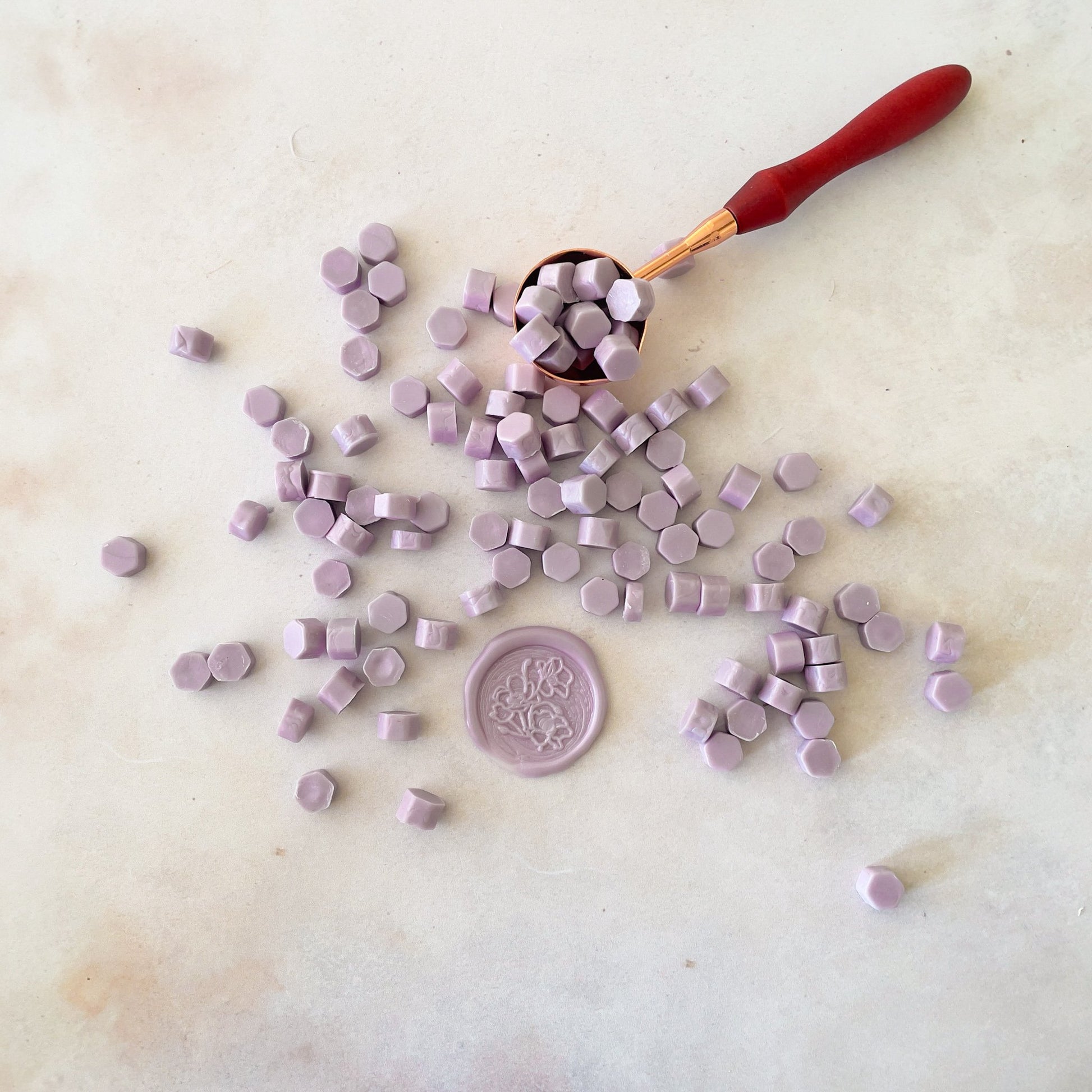 Lilac wax seals made with eco friendly sealing wax beads by The Natural Paper Company