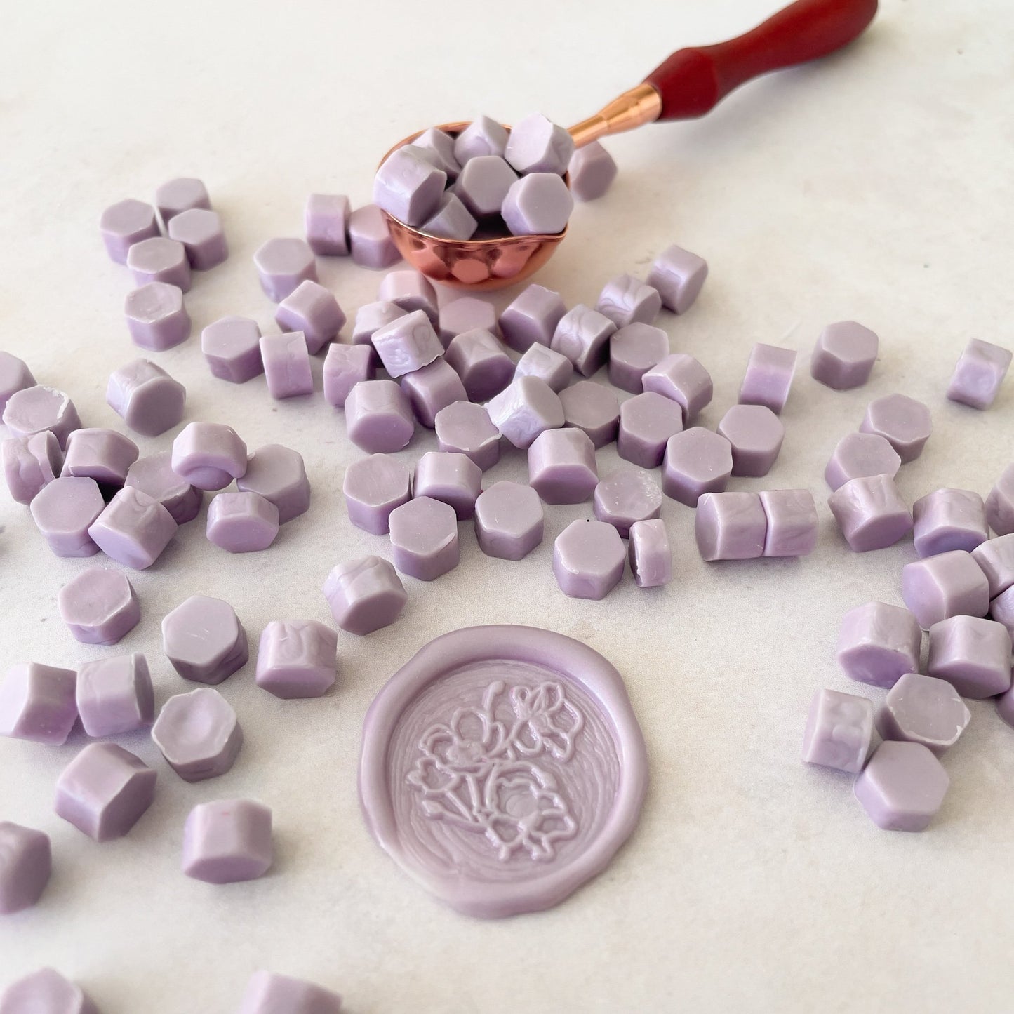 Eco friendly sealing wax beads in lilac colour.  Make wax seals to decorate stationery, cards, envelopes and gift wrap.  by The Natural Paper Company