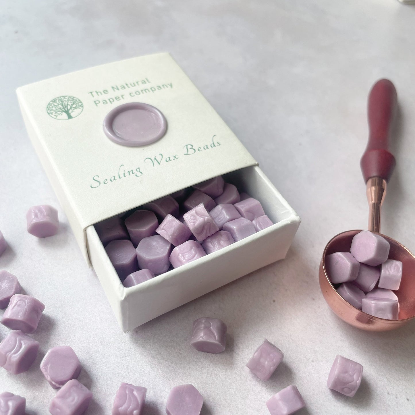 Lilac wax beads for making wax seals.  Eco friendly wax for wax stamping.  By The Natural paper Company