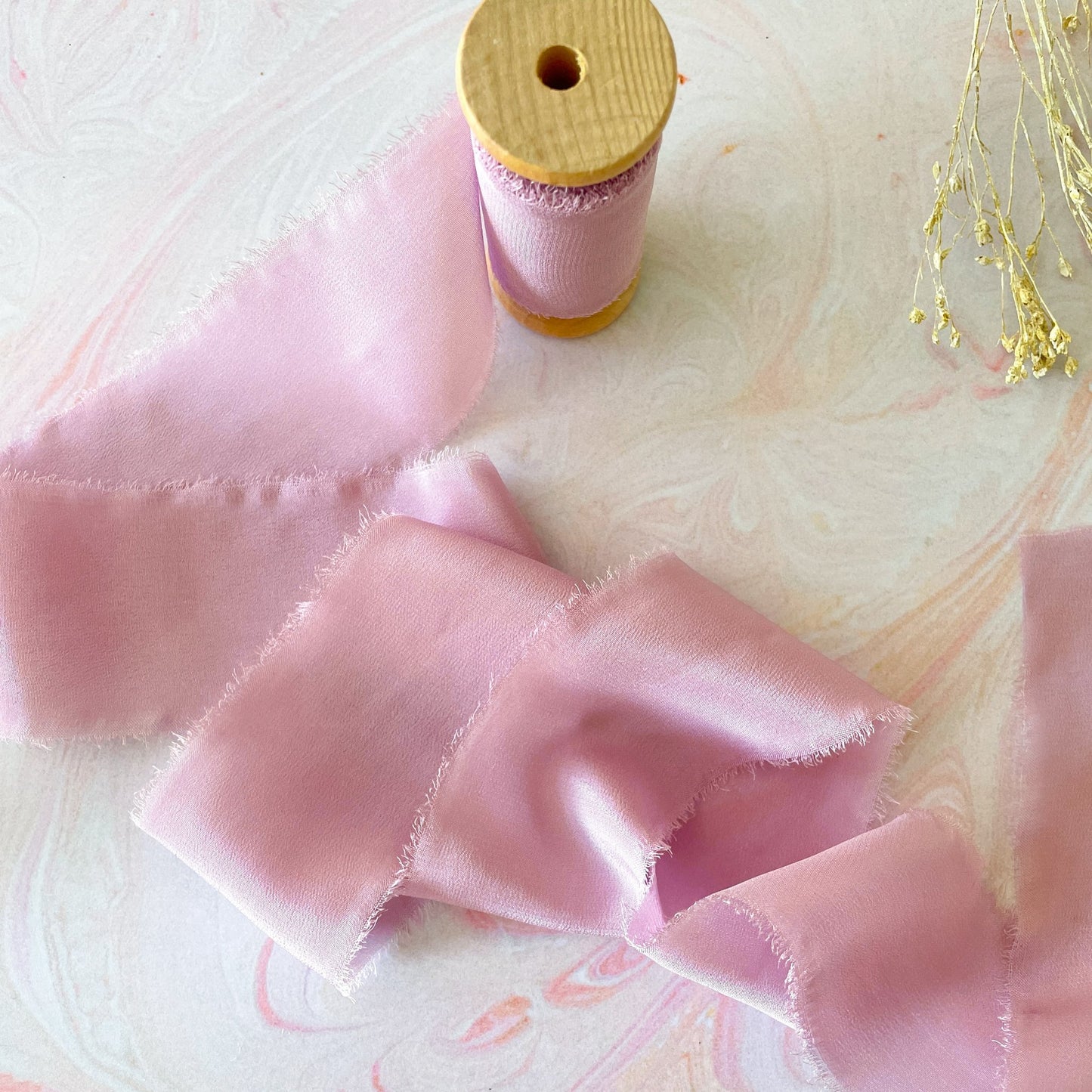 Luxury silk ribbon in lilac.  Fine habotai silk ribbon on a wooden spool.  By The Natural Paper Company.