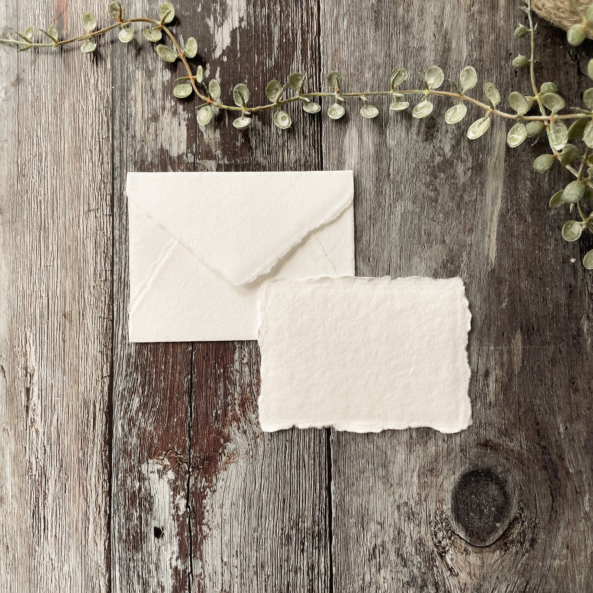 Small handmade paper envelopes and cards.  White C7 envelopes and cards made from recycled cotton rag paper with a deckled edge.  By The Natural paper Company