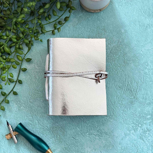 little silver leather notebook made by hand.  