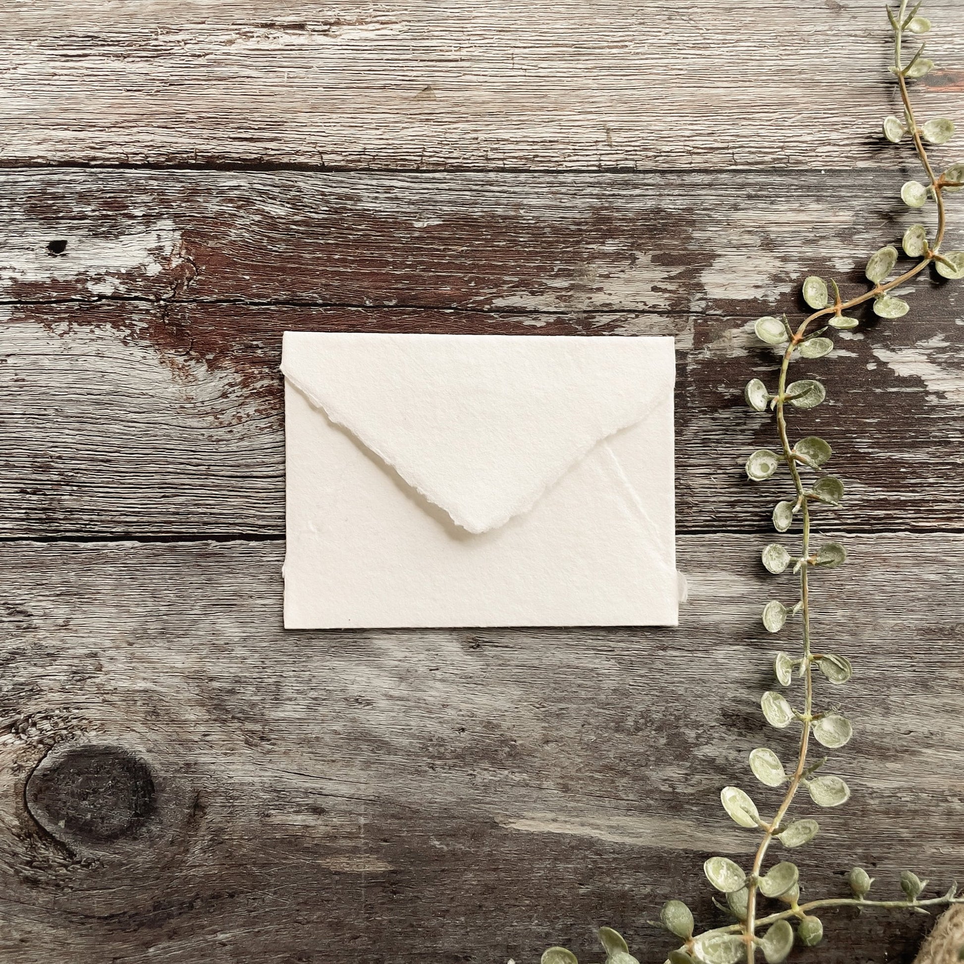 Small handmade paper envelopes in white.  Perfect little envelopes for RSVP cards, calling cards, business cards etc.  Made from recycled cotton rag paper with a deckled edge.  By The Natural paper Company