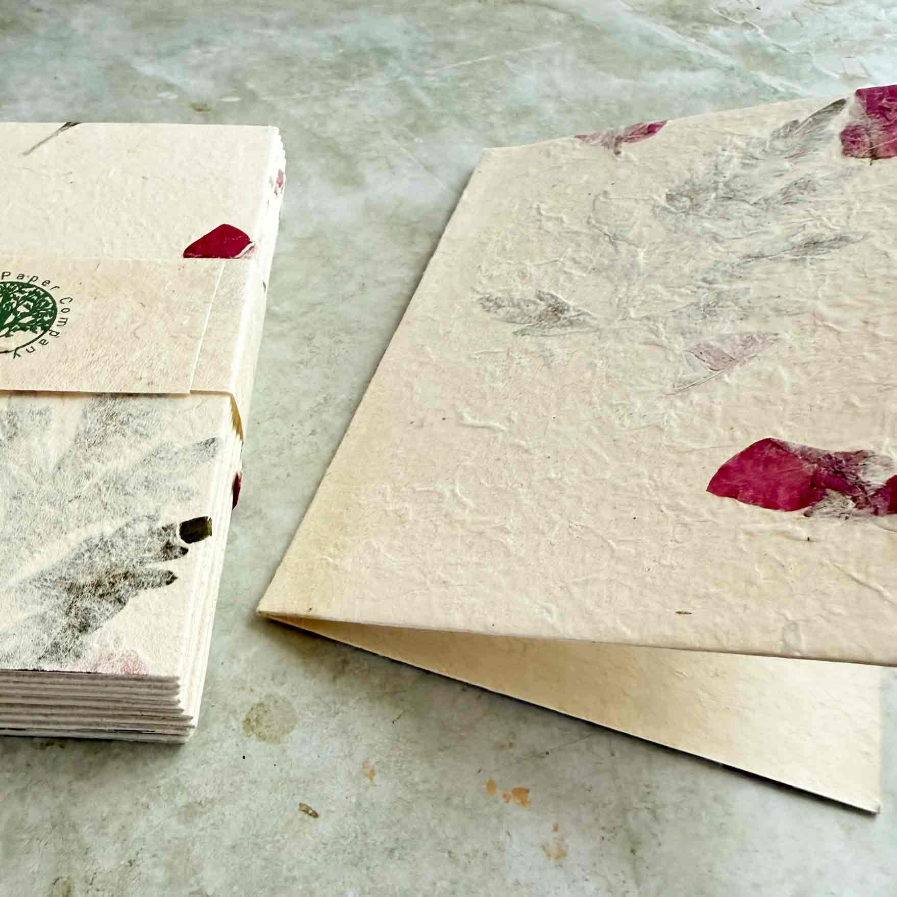 set of folded a6 cards made from handmade lokta paper with dried flowers