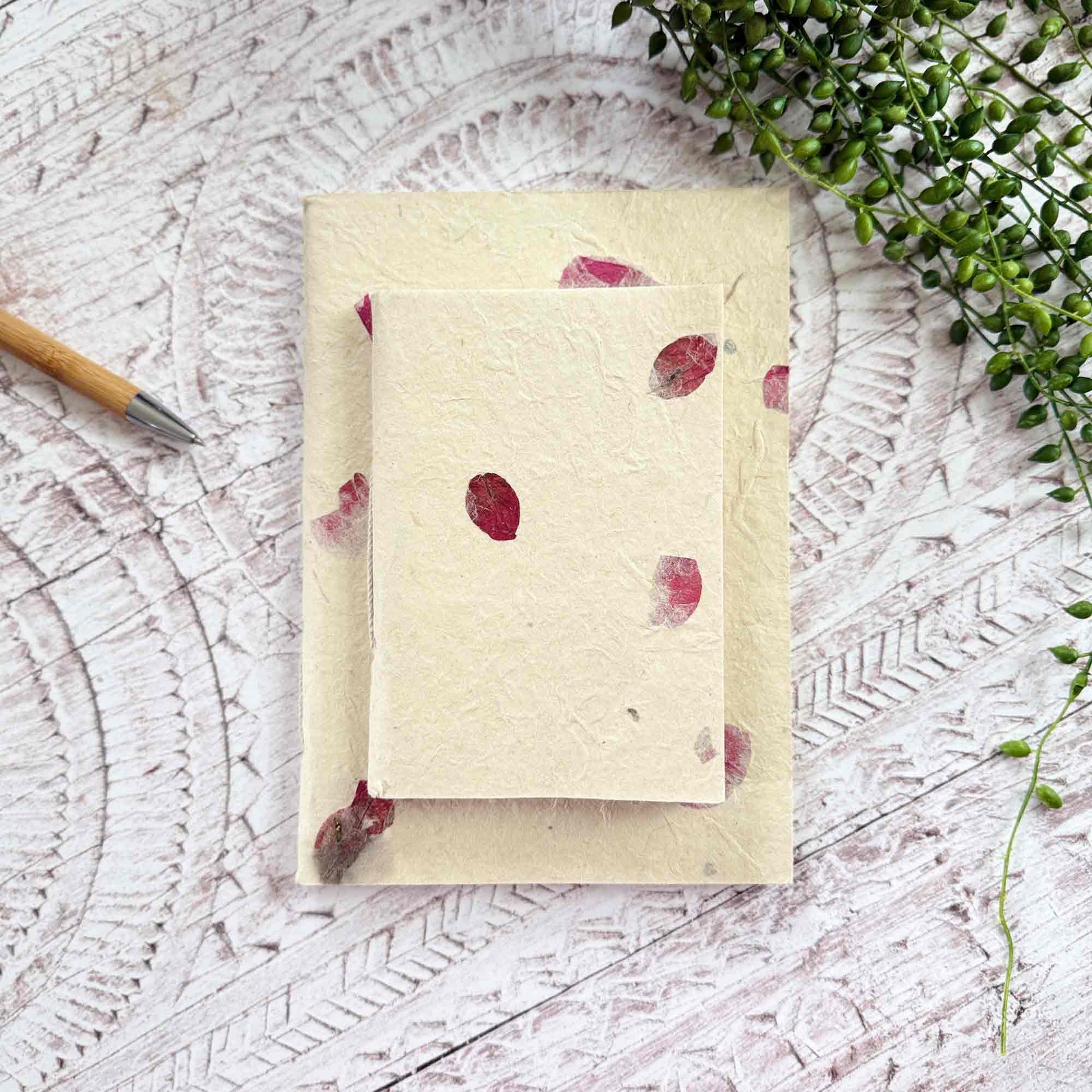 Pair of Lokta notebooks in A5 and A6 sizes, decorated with real Bougainvillea petals, handmade in Nepal
