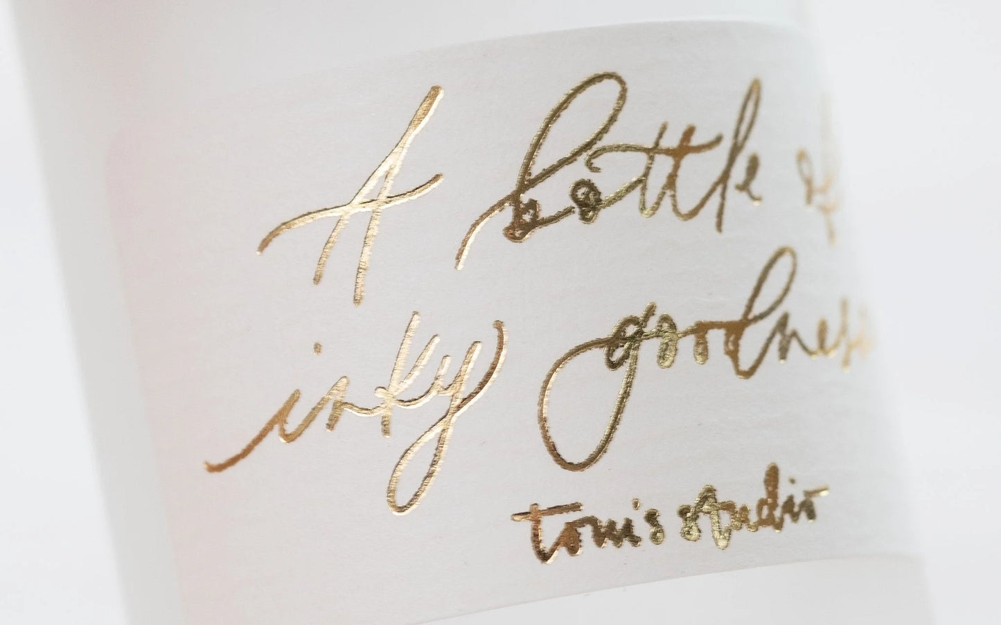 Metallic gold ink for calligraphy. 