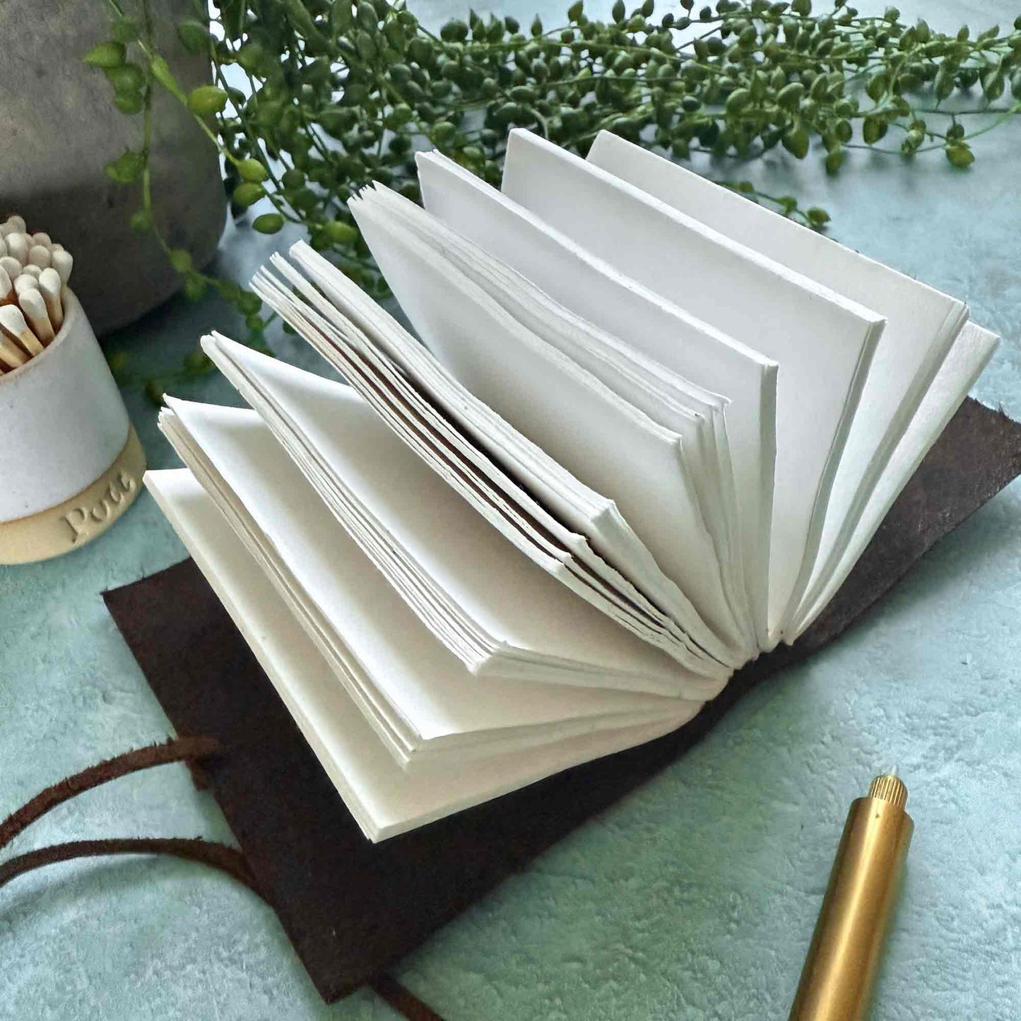 small handmade leather notebook with cotton paper pages