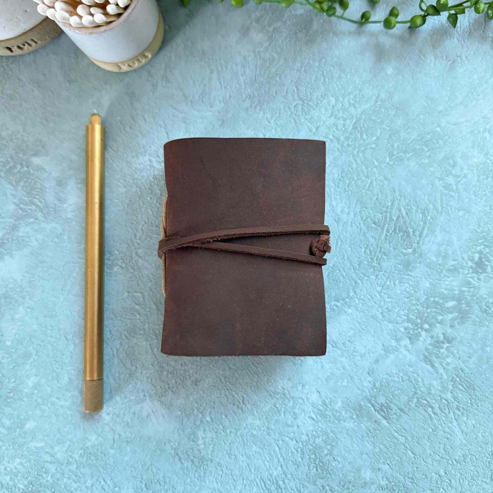 miniature handmade leather notebook with blank cotton paper pages