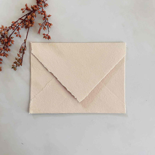 handmade cotton rag paper envelopes in blush pink.  Deckle edge envelopes