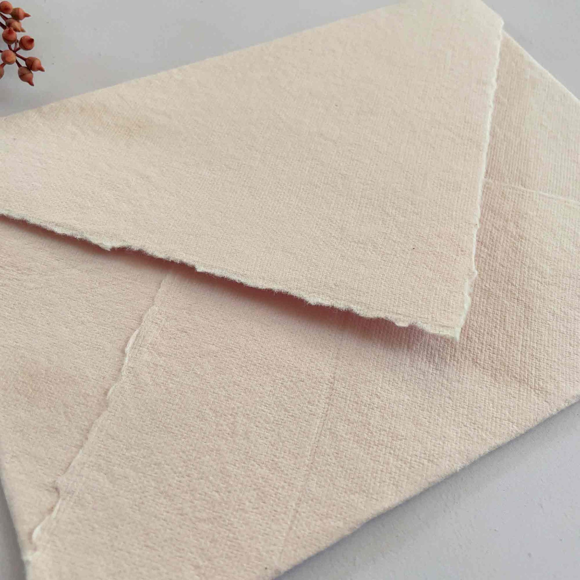 handmade paper envelope in blush pink.  Made from recycled cotton rag fibres