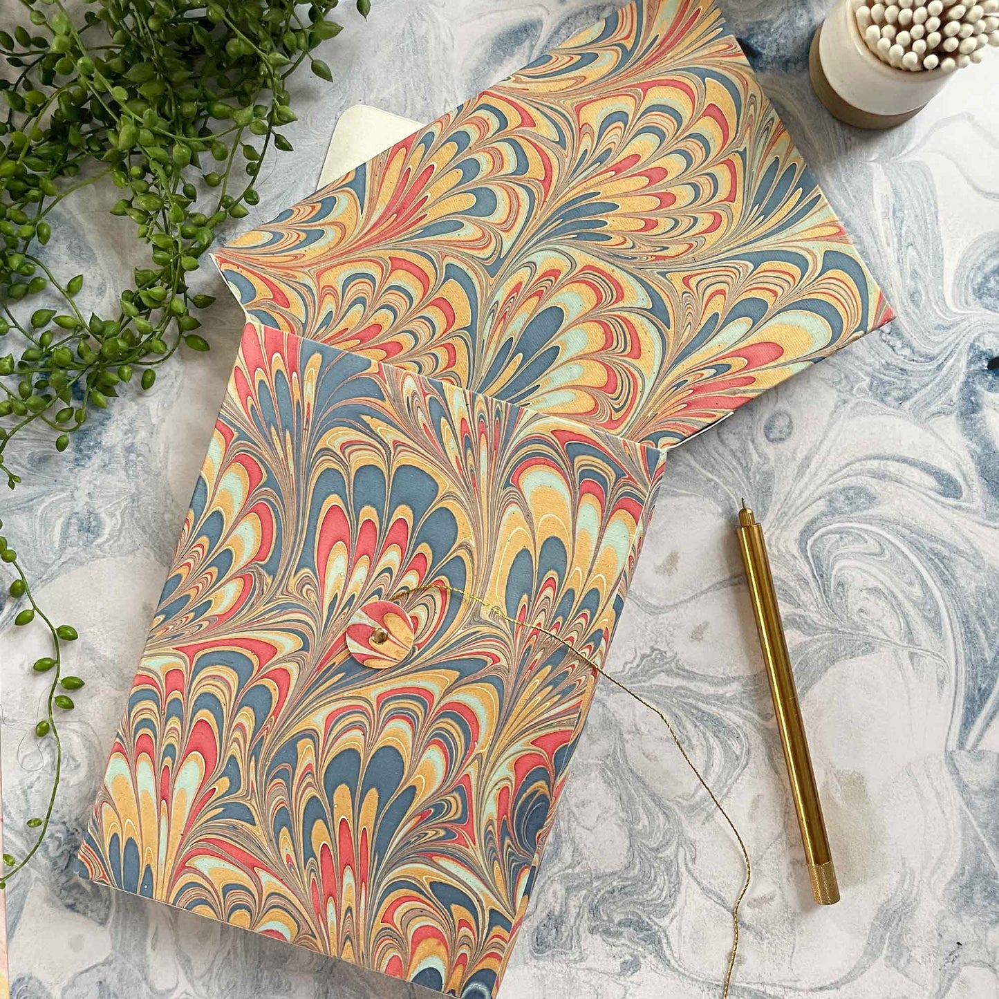 hand made journal in gift box.  Hand marbled cover with matching bag.  Elegant notebook